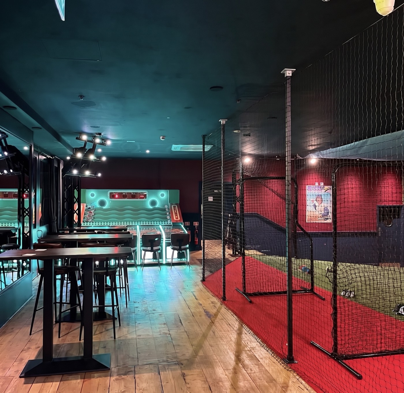 Inside Hit King Aldgate — batting cages and bar tables